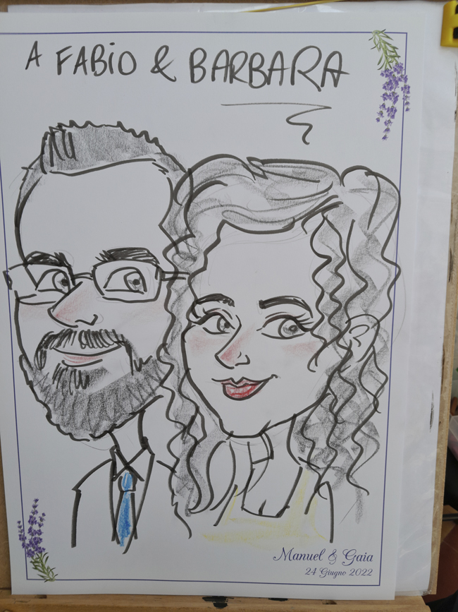 una caricatura di coppia eseguita su foglio personalizzato per l'evento